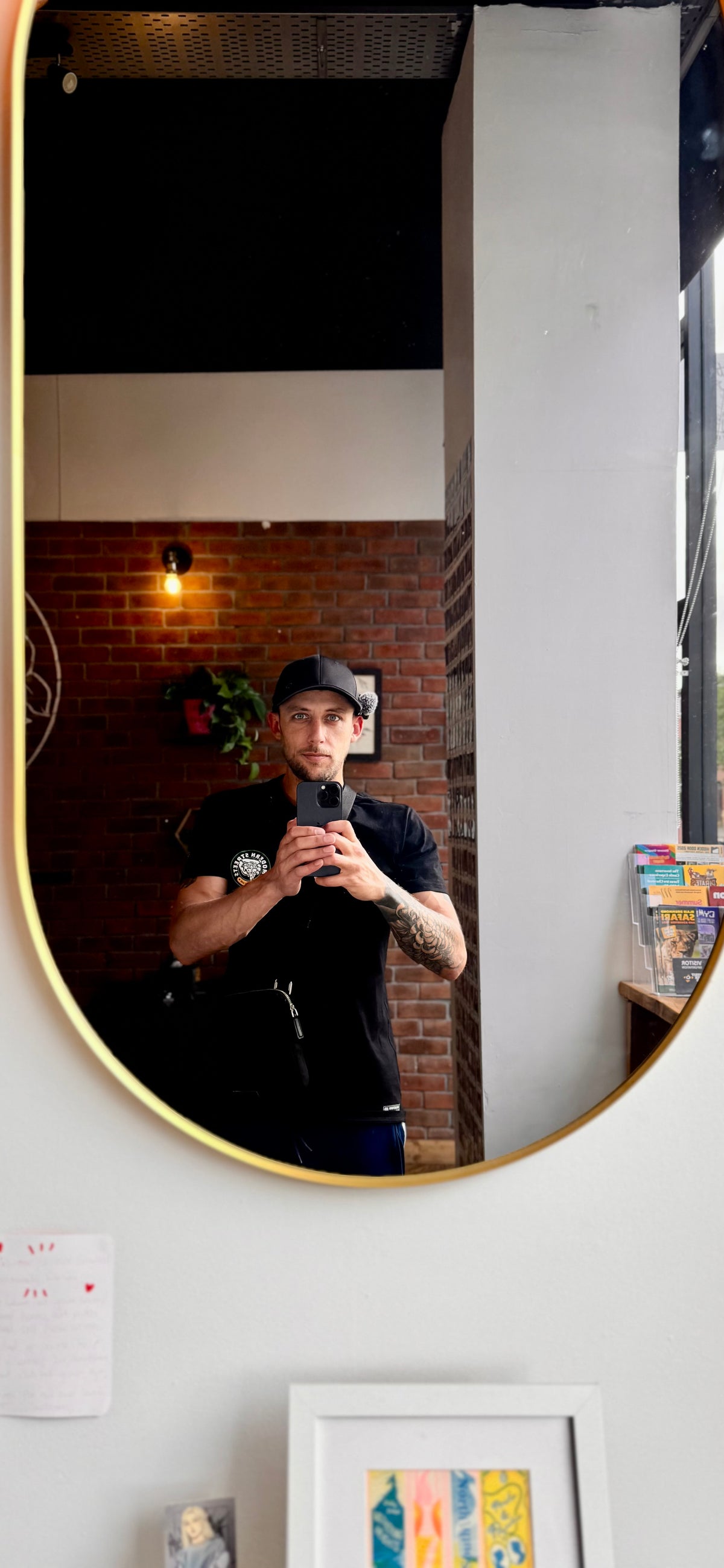 Bobby taking a mirror photo at his coffee setup